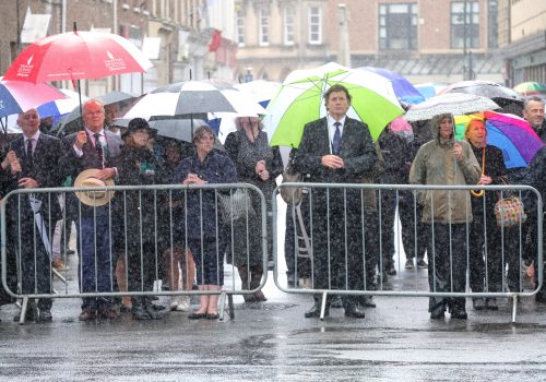 People in Taunton, UK watch on a large screen the funeral service for Barnaby Webber, one of the victims of the Nottingham attack, July 14, 2023. (Source: Reuters)