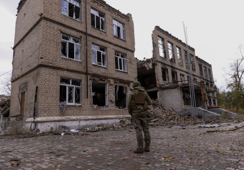 FILE PHOTO: A police officer stands in front of a damaged building, amid Russia's attack on Ukraine, in the town of Avdiivka, Donetsk region, Ukraine October 17, 2023. REUTERS/Yevhen Titov/File Photo