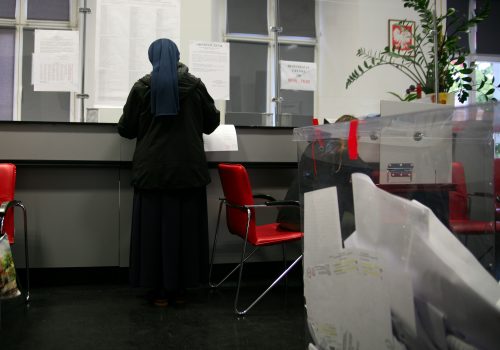 KRAKOW, POLAND - OCTOBER 13: Voting at a polling station during the parliamentary elections on October 15, 2023 in Krakow. Poland. Parliamentary elections were held in Poland on October 15. The elections were accompanied by a highly controversial referendum during which four questions were asked, including about migration policy. (Source: Klaudia Radecka/NurPhoto via Reuters)