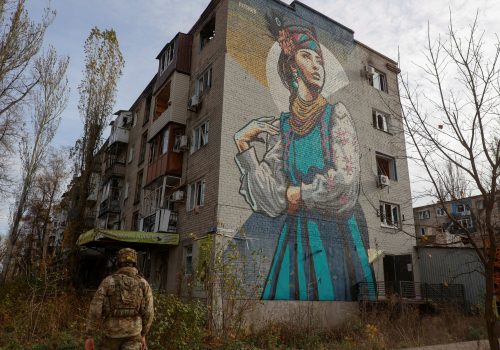 A Ukrainian serviceman walks next to a residential building heavily damaged by Russian military strikes in the city of Avdiivka, Ukraine November 8, 2023. (Source: Radio Free Europe/Radio Liberty/Serhii Nuzhnenko via Reuters)